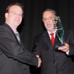 Mike North (left) being presented with the 2007 Emerging Biotechnologist of the Year trophy by Robin Congreve, then chairman of the award sponsors Neuren Pharmaceuticals.